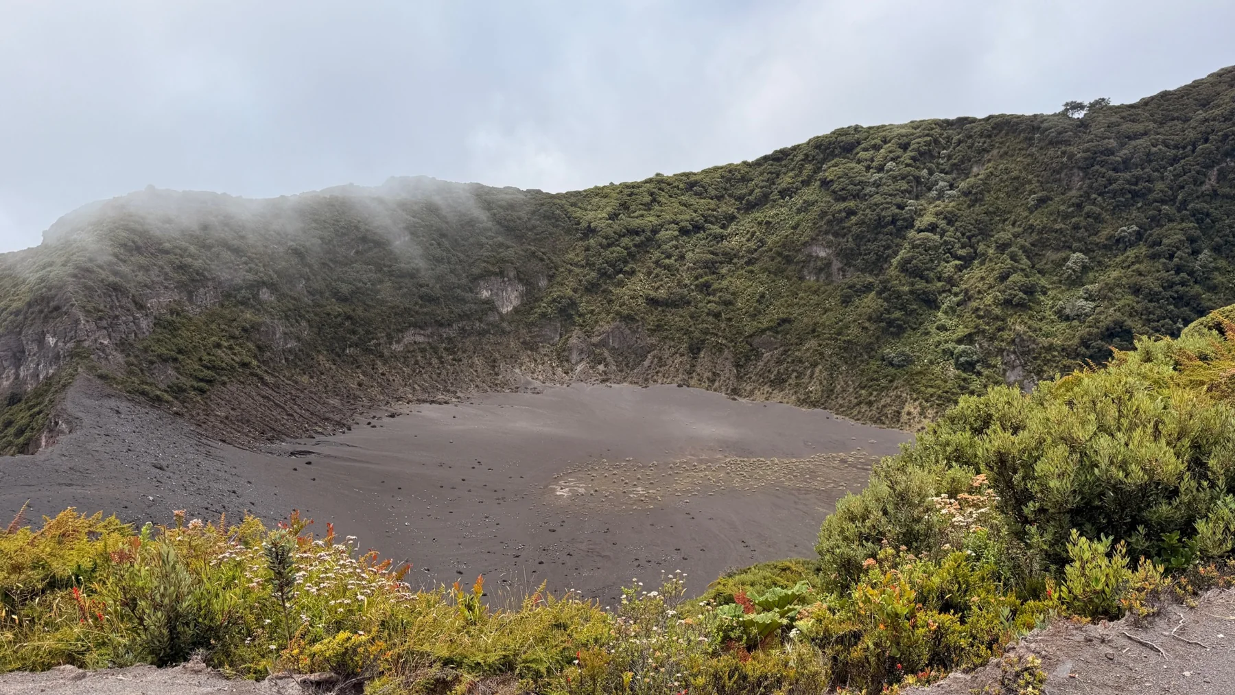 Clouds drifting over a volcanic crater