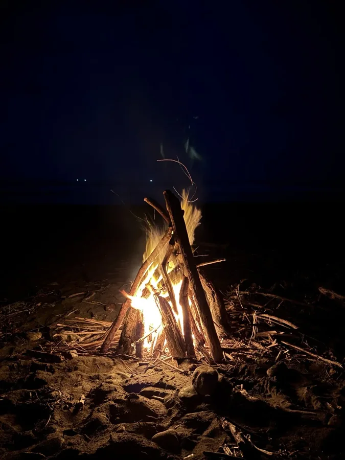 An evening around the beach bonfire