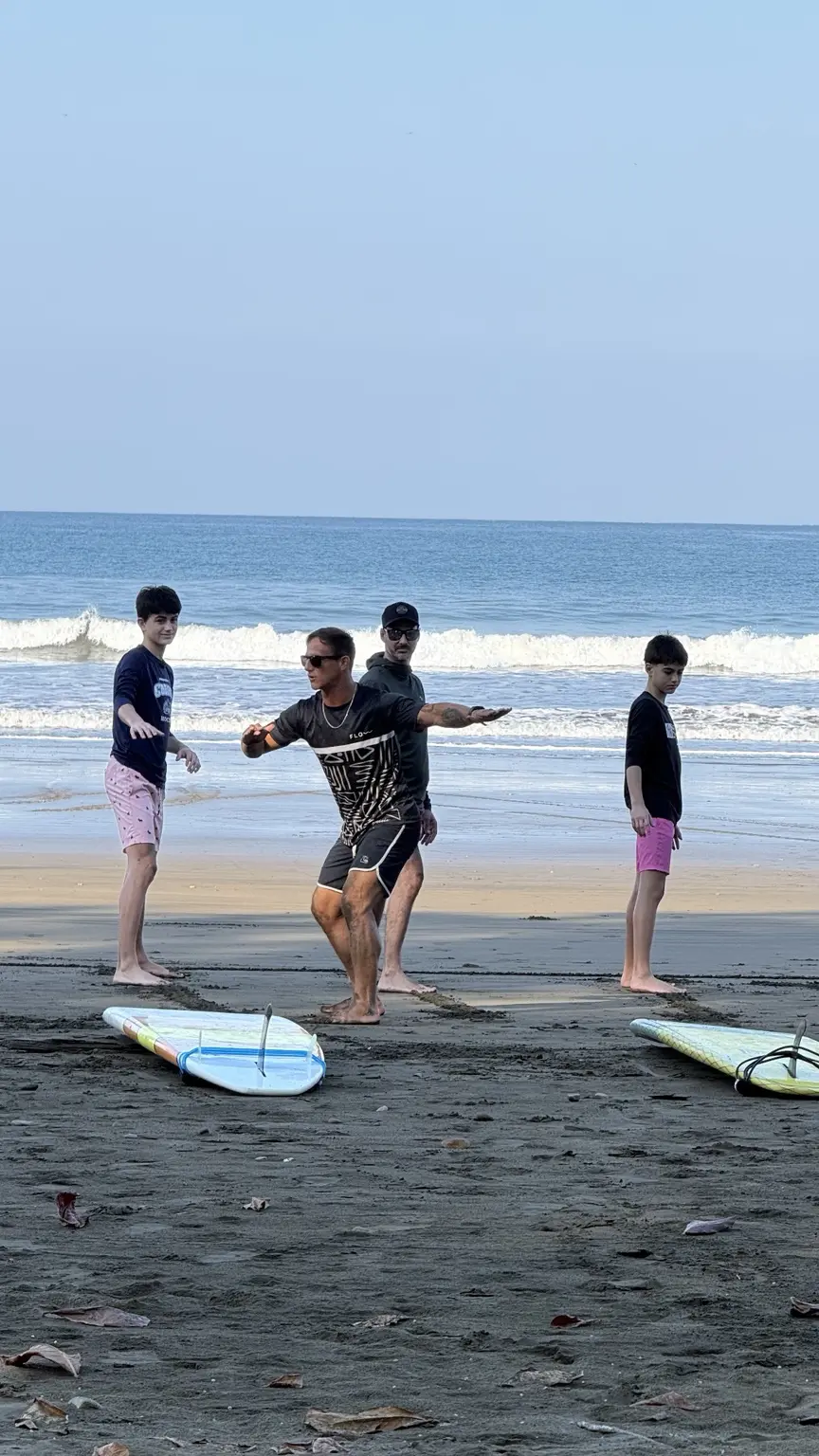 Surf coaching demonstration on the beach