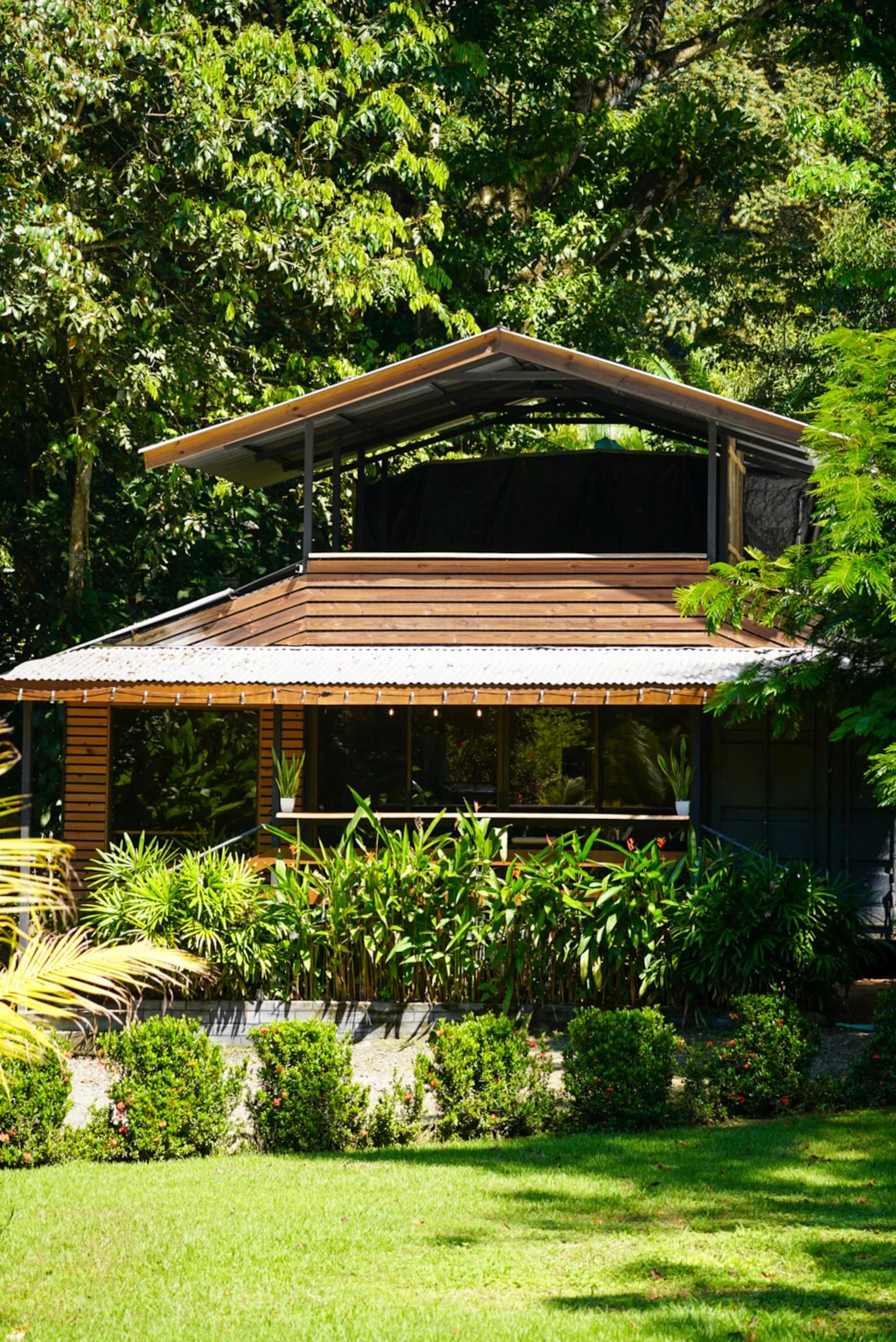 Zion’s House surrounded by its tropical garden in Dominicalito